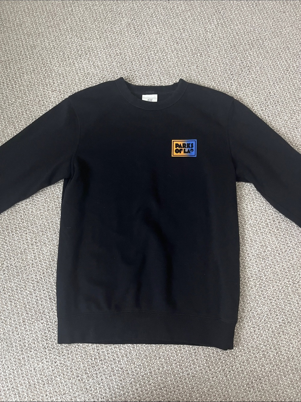 H&M Black Crewneck Sweatshirt with Blue and Yellow Chest Patch